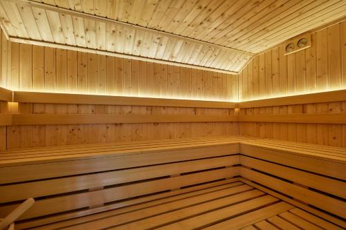 a sauna with wooden paneling and a ceiling at Leśny Dworek - Pokoje & Apartamenty in Białka Tatrzanska