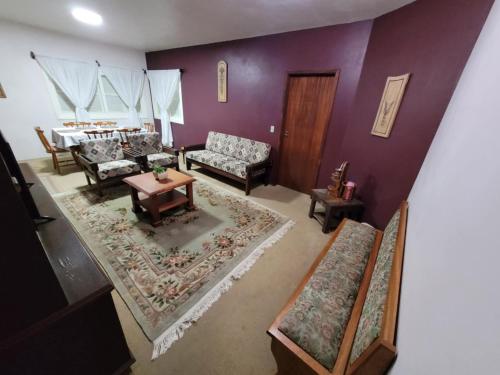 an overhead view of a living room with purple walls at Casa Planalto Gramado in Gramado