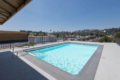 a swimming pool on the roof of a building at Stylish 2BR Apt with Rooftop Pool & Hollywood Views in Los Angeles