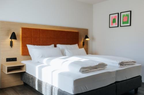 Un ou plusieurs lits dans un hébergement de l'établissement Hotel zwölf87
