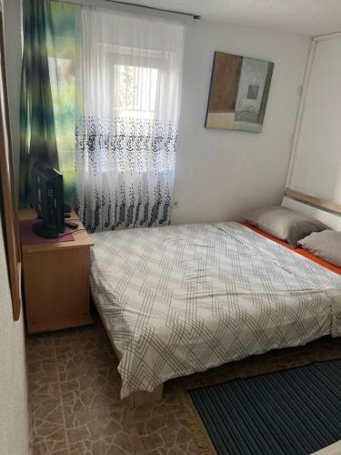 Postel nebo postele na pokoji v ubytování Apartmani Amira Sutomore