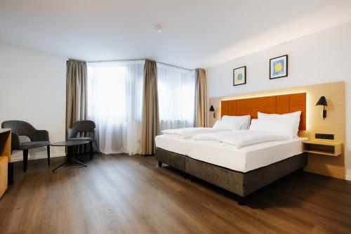 Un ou plusieurs lits dans un hébergement de l'établissement Hotel zwölf87