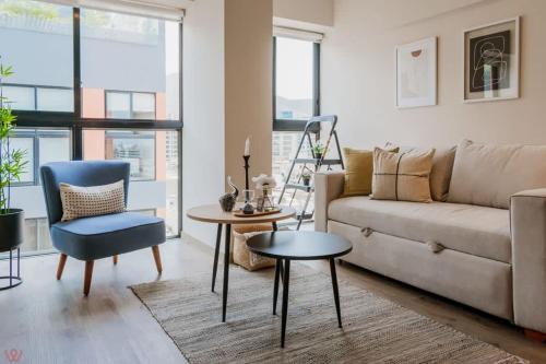 a living room with a couch and a table at Appealing 1BR Comfy apartment in Surco in Lima