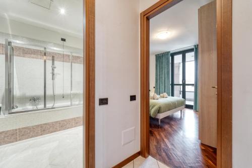 a door leading to a bedroom with a bed at Residenza Elena in Como