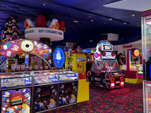 a room with many different arcade games and toys at Pacific Hotel in Clacton-on-Sea
