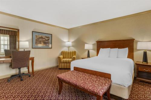 a hotel room with a bed and a desk at Best Western PLUS Morristown Inn-Florham Park in Morristown
