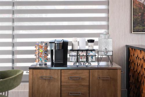 a counter with a coffee maker on top of it at Aiden by Best Western St George in St. George