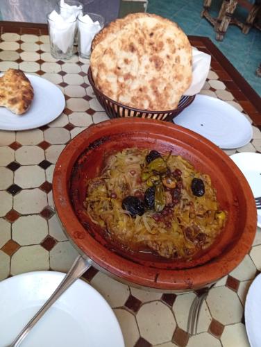 a bowl of food sitting on top of a table at appartement de vacance Aourir2 in Aourir