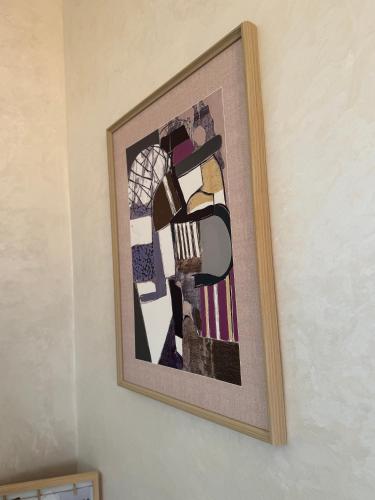 a picture hanging on a wall in a room at Ciel&Azur in Sidi Ifni