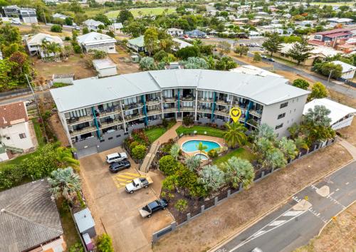 an aerial view of a building with a pool at Yeppoon CBD furnished apartment with pool! in Yeppoon