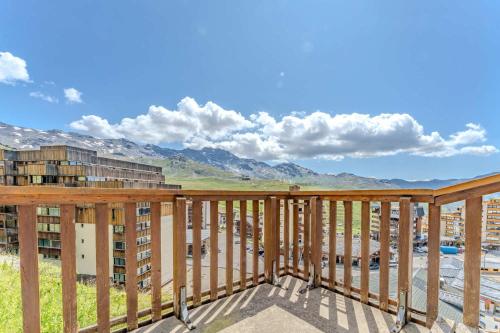a balcony with a view of the mountains at Cozy Alpine Chalet with Ski-In access and Parking in Val Thorens 10 Niverolles in Val Thorens