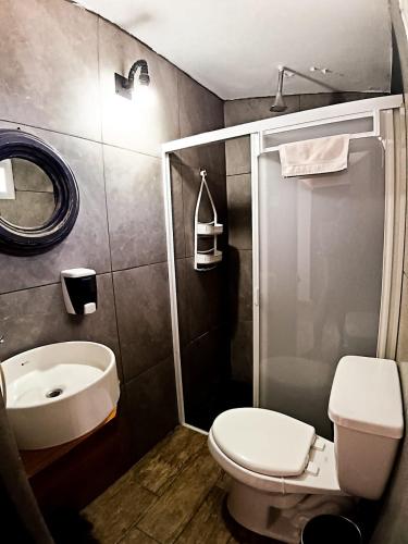 a bathroom with a toilet and a sink at Suite París, Paseo Durango in Durango