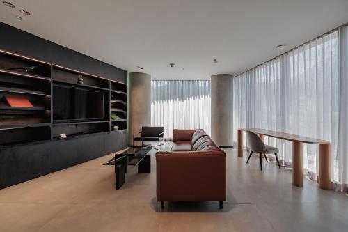 a living room with a couch and a table at Seissta Medellín in Medellín