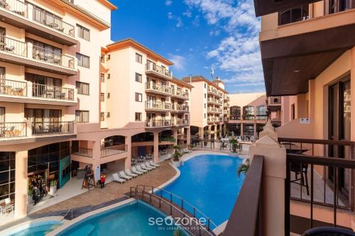 Bazén v ubytování Estúdios Modernos em Resort pé na areia - Jurerê Beach Village JBVJR nebo v jeho okolí