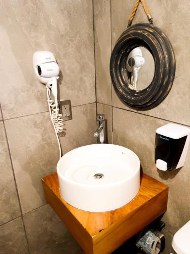 a bathroom with a white sink and a mirror at Loft familiar, Paseo Durango in Durango