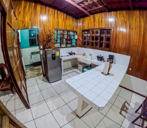 an overhead view of a kitchen with a table and sink at CASA DE CAMPO JACUZZI MONTAÑA NATURALEZA Leso in San Lorenzo