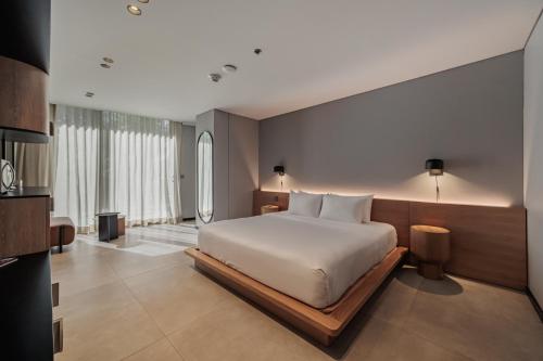 a bedroom with a large bed in a room at Seissta Medellín in Medellín