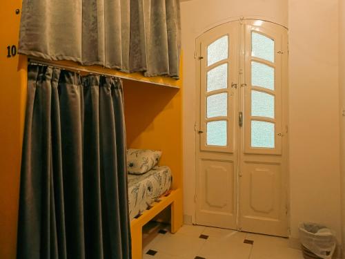 a room with a door and a window at Bonita Chillhouse in Aswan