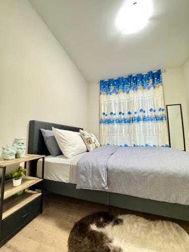 a bedroom with a bed and a window at Crystal's Place in Moncton