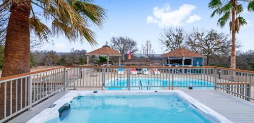 a swimming pool with a deck and a resort at Scenic 5-Acre Retreat with Hot Tub Pool & Game Room in Manor