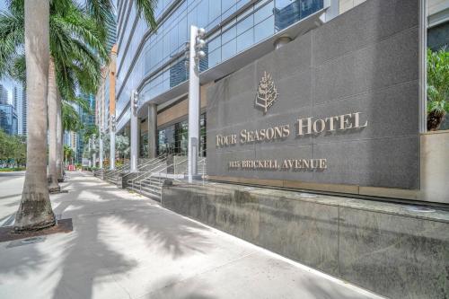 a building with a sign for the ruf seasons hotel at Four Seasons Miami Luxury Two-Bedroom Suite in Brickell - Free Parking in Miami