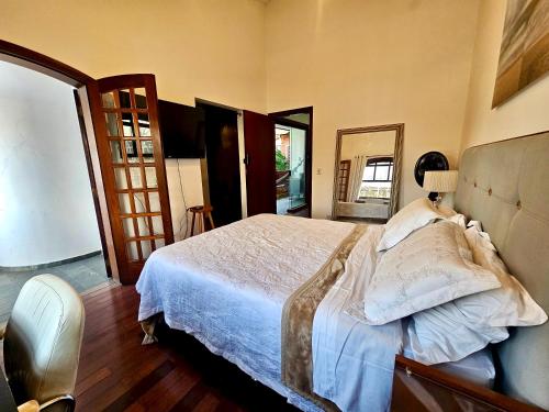 Postel nebo postele na pokoji v ubytování Quartos Aconchegantes em Casa Gigante no meio do Brooklin