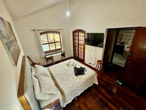 Postel nebo postele na pokoji v ubytování Quartos Aconchegantes em Casa Gigante no meio do Brooklin