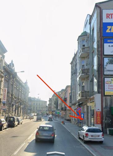 a traffic light on a city street with cars at Apartament Mickiewicza - PKP Station in Przemyśl