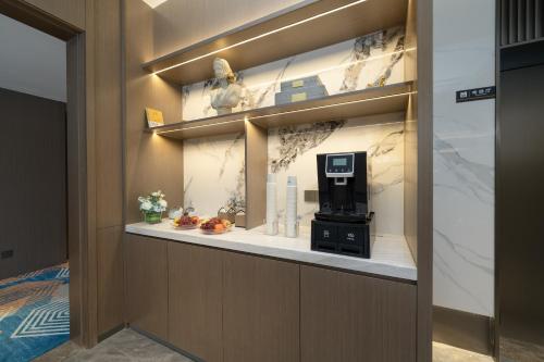 a lobby with a atm machine on a shelf at Yizhi Hotel - Guangzhou Shamian Island Huangsha Metro Station-Canton Fair free shuttle bus included Breakfast in Guangzhou