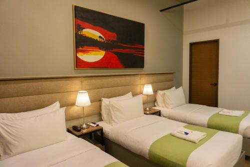 Katil atau katil-katil dalam bilik di Avioré Hotel Tacloban