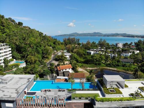 an aerial view of a resort with a swimming pool at Aristo 2 Phuket by RESAVA in Surin Beach