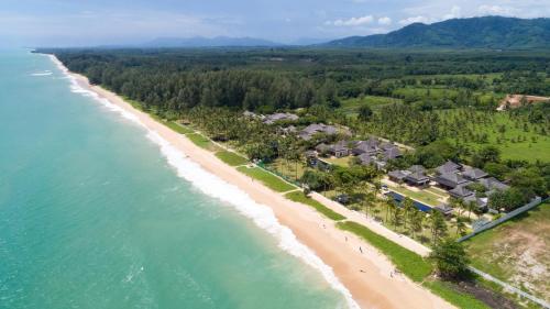 an aerial view of a beach with houses at Jivana Beach Villas in Natai Beach