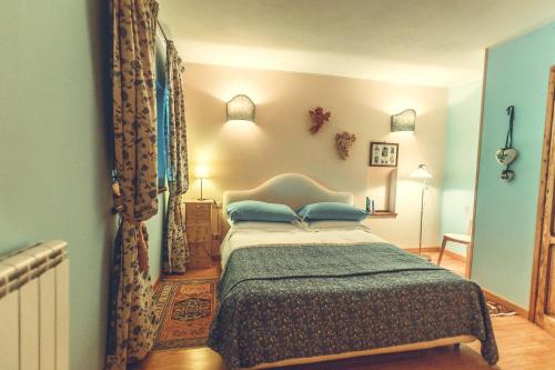 Ένα ή περισσότερα κρεβάτια σε δωμάτιο στο Il Boschetto Di Castagni