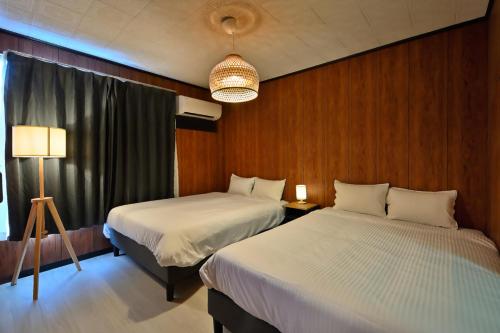 Katil atau katil-katil dalam bilik di Castle Land NAGOYA Family Friendly 5min from Station