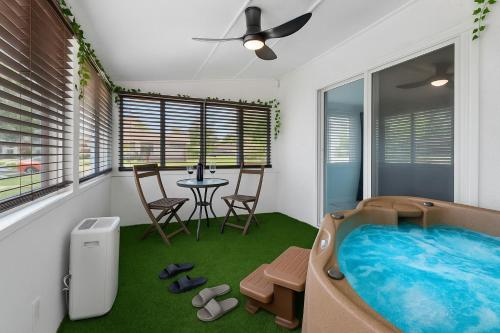 a bathroom with a jacuzzi tub in a room at Walk to Downtown - 3BR with Hot Tub & Games in St. Augustine