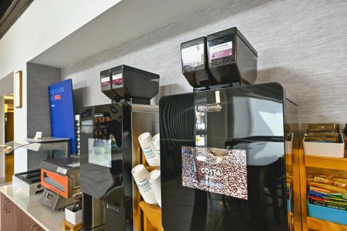a store with a display of shoes and a coffee maker at Holiday Inn Express Houghton-Keweenaw by IHG in Houghton