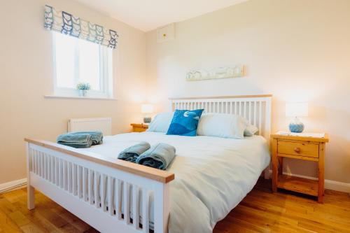 En eller flere senge i et værelse på Edith Cottage, Saundersfoot