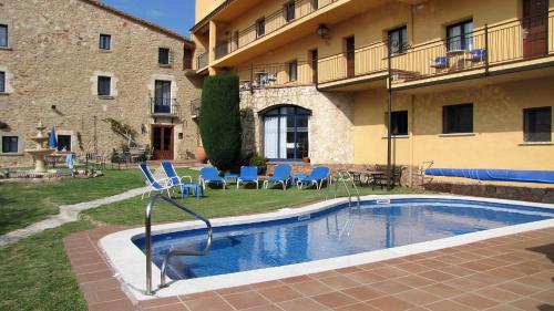 Bazén v ubytování Hotel Sant Joan nebo v jeho okolí