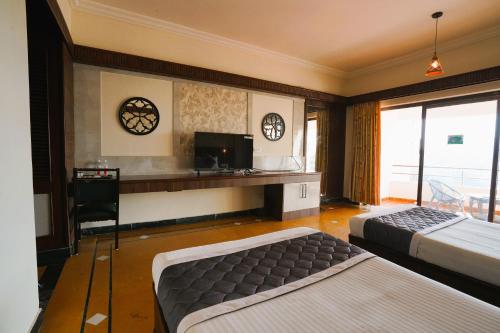 Postel nebo postele na pokoji v ubytování Greencoconutresort