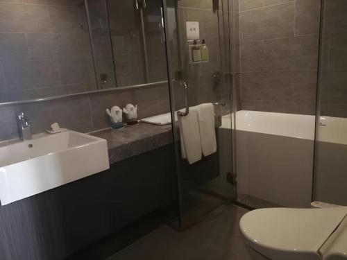 Ванная комната в Xiamenair Maple Hotel (Xiamen SM City Plaza)