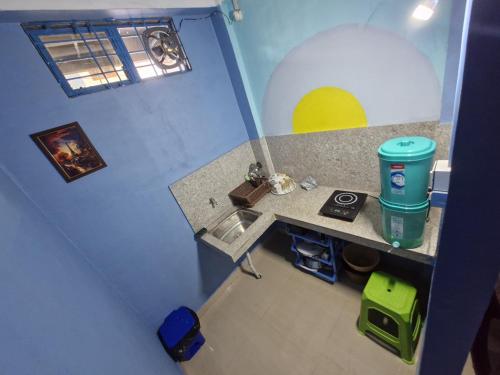 an overhead view of a kitchen with a sink at The Urban Homestay Premium Floating Bed AC Room Free Parking in Dibrugarh
