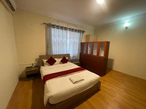 Katil atau katil-katil dalam bilik di Hotel Jigmeling Appartments