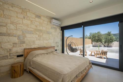 Ένα ή περισσότερα κρεβάτια σε δωμάτιο στο Villa Kumarēs