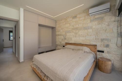 Ένα ή περισσότερα κρεβάτια σε δωμάτιο στο Villa Kumarēs