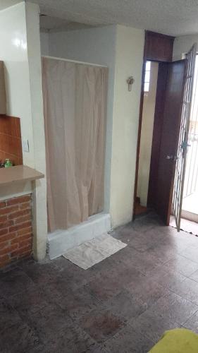 an empty room with a shower curtain in a room at Departamento C-3 in Mexico City