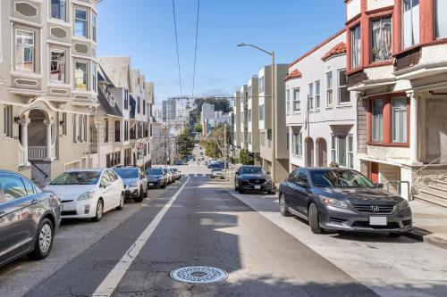 a street with cars parked on the side of the road at Open-Plan Gold Rush Suite In Central SF - Location and Luxury in San Francisco