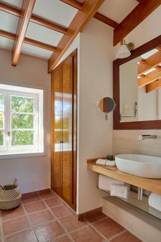a bathroom with a sink and a mirror at Son Granot Hotel Rural in Es Castell