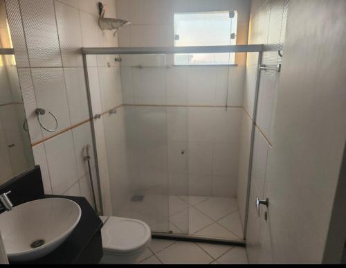 a bathroom with a shower and a toilet and a sink at Belíssima Casa super confortável com piscina e área gourmet in Feira de Santana