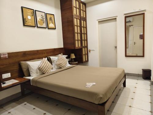 a bedroom with a large bed in a room at Casa Mel in Puducherry