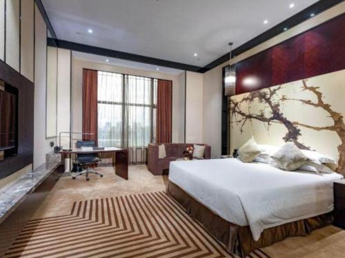 En eller flere senge i et værelse på Winway Hotel